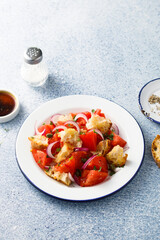 Traditional Italian salad with tomatoes and bread