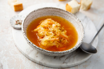 Homemade sauerkraut soup served with bread