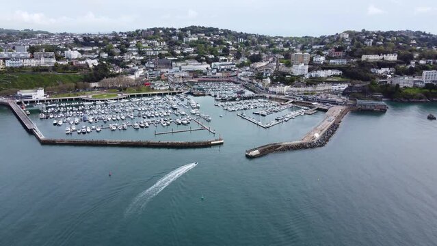 Torquay marina aerial video. English riviera with a boatarriving at Torbay marina and harbour. 
