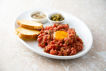 Traditional steak tartare with egg yolk
