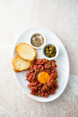 Traditional steak tartare with egg yolk