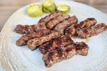 Kebabs served on a plate in a restaurant. Macedonian kebab.