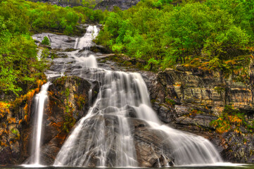 Waterfall in Long Exposure in the Forest in Valle Maggia, Ticino, Switzerland.