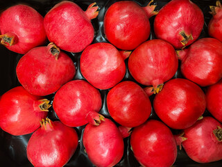 Group of pomegranates. Pomegranate closeup. Red pomegranate Background or wallpaper.