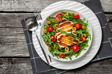 salad with grilled halloumi greek cheese in bowl