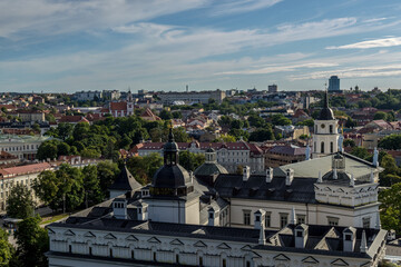 Obraz premium Beautiful view over a part of Vilnius in Lithuania surrounded by forest during a sunny day in summer.