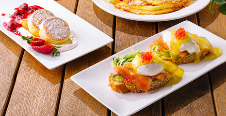 Gourmet brunch spread on wooden table