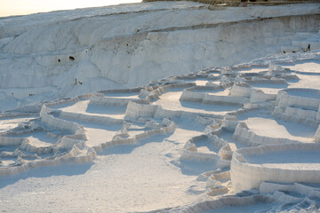 Natural travertine pools and terraces in Pamukkale. Travertines with no water left in their pools