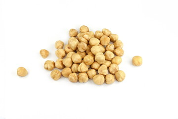 Hazelnut isolated on white background. Pile of peeled roasted hazelnuts isolated on white background. 