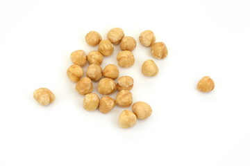Hazelnut isolated on white background. Pile of peeled roasted hazelnuts isolated on white background. 