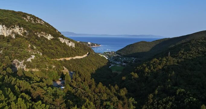 Aerial shot in middle mountains, overlooking the Rabac resort, in Istria, Croatia
