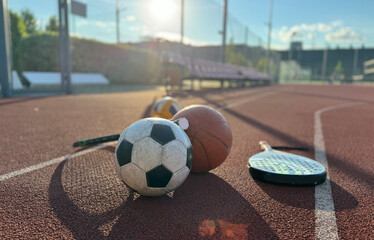 Set of sport equipment, rackets and tennis balls soccer and basketball balls