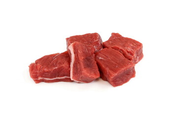Fototapeta premium Pile of beef cubes isolated on white. raw diced beef meat ready for goulash. cubes of meat streaked with fat