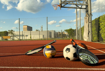 Set of sport equipment, rackets and tennis balls soccer and basketball balls
