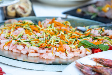 fresh shrimp and vegetable salad served on platter at outdoor wedding reception