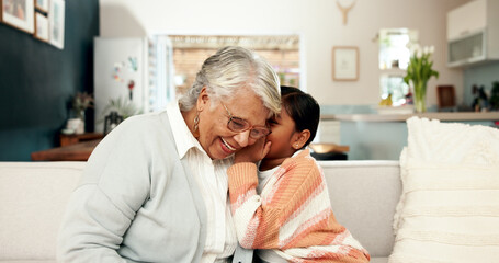 Secret, child and grandmother in living room, home and whisper for funny joke in ear. Bonding, sofa...