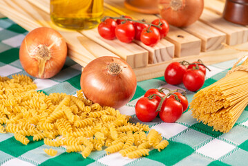 Pasta, table with pasta, ingredients and utensils, selective focus.