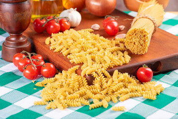 Pasta, table with pasta, ingredients and utensils, selective focus.
