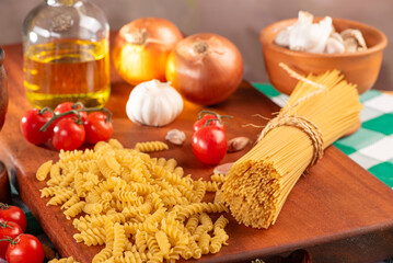 Pasta, table with pasta, ingredients and utensils, selective focus.