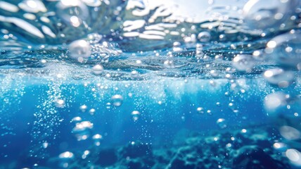 Underwater view of bubbles rising toward water surface