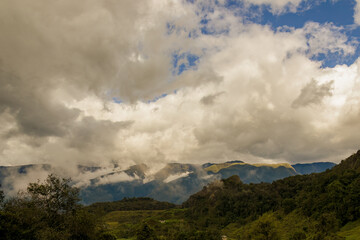 Low clouds floating over t he mountains in the eastern Andean range of Colombia, in a overcast afternoon, near the town of Arcabuco.