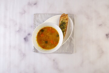 Sorrentina soup with bread served in dish isolated on grey background top view of italian fastfood