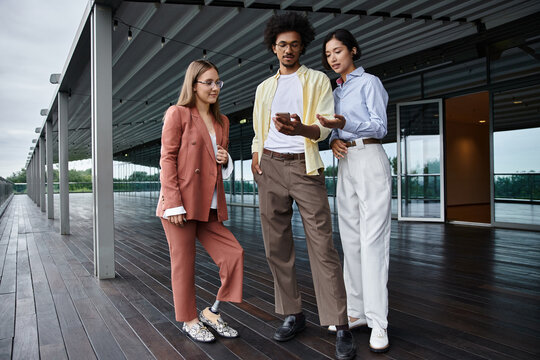 Three colleagues on a rooftop demonstrate inclusion and accessibility in the modern workplace.