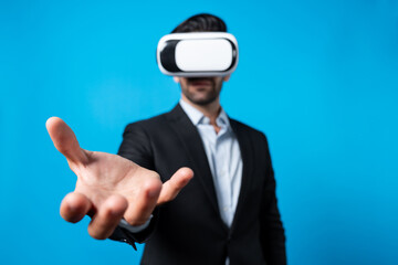 Professional smart business man holding something while wearing VR glasses. Caucasian project...