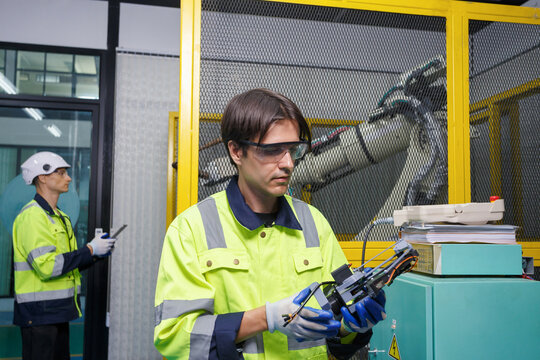 automation machine engineer students study and inspection control robot arm machine in robotics engineering academy at university or factory workshop. AI robot technology, future innovation trend.