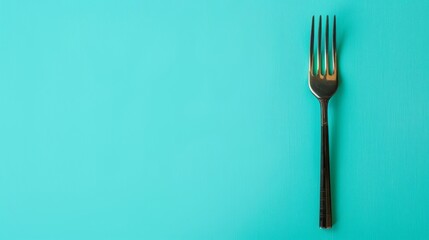 A single silver fork on a bright blue background.