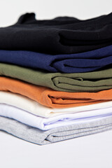 premium blank t-shirts, various colors, stacked, mockup, 100% cotton, basic collection, unbranded and unprinted