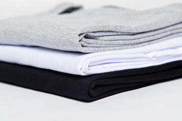 premium blank t-shirts, various colors, stacked, mockup, 100% cotton, basic collection, unbranded and unprinted