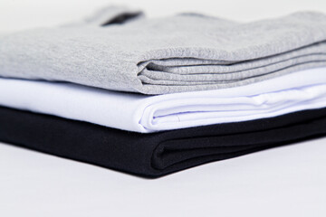 premium blank t-shirts, various colors, stacked, mockup, 100% cotton, basic collection, unbranded and unprinted