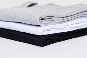 premium blank t-shirts, various colors, stacked, mockup, 100% cotton, basic collection, unbranded and unprinted
