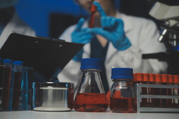 professional chemist woman laboratory using scientific microscope for science research, chemistry scientist with microbiology medicals equipment technology to working with medicine biology experiment