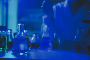 professional chemist woman laboratory using scientific microscope for science research, chemistry scientist with microbiology medicals equipment technology to working with medicine biology experiment