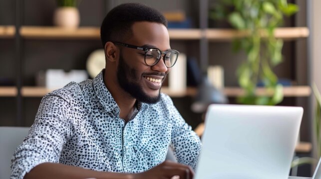 Happy glasses, laptop, man, and smile for home office research, copywriting, and remote work. Computer, employee, and online project reader or worker