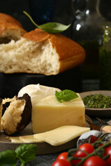 assorted cheeses for snacks on a board