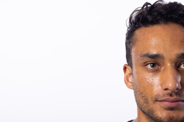 Fototapeta premium Close-up of a young biracial man, with copy space, on a white background