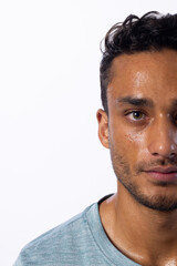 Obraz premium Close-up of a young biracial man, with copy space, on a white background