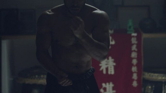 Man practicing his undercut punching moves