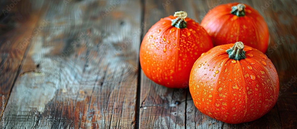 Poster cut ripe pumpkins placed on a wooden table with space for text or graphics. image with copy space