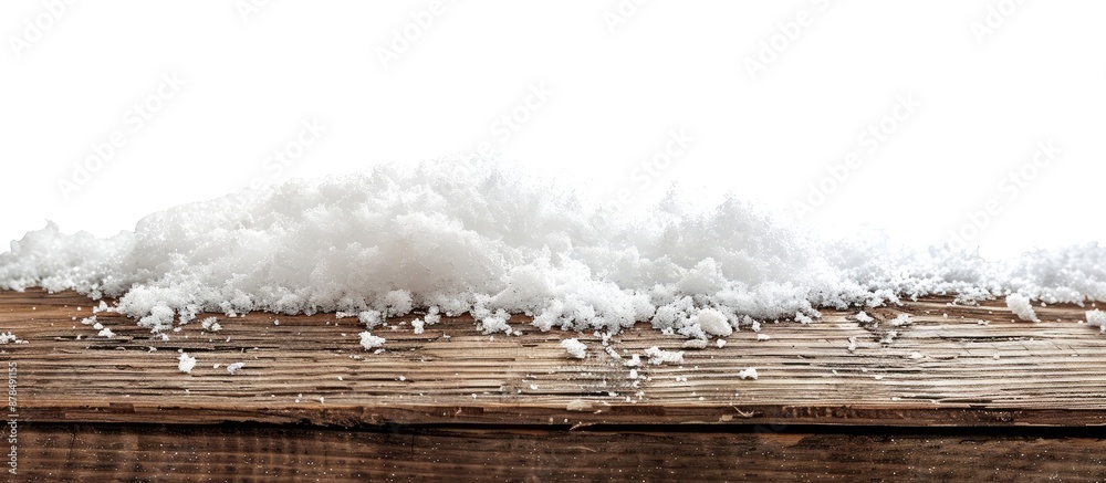 Poster christmas season setting with a pile of snow on a wooden surface against a white backdrop, creating 