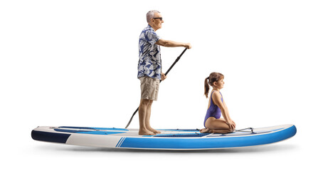 Grandfather paddling a SUP in the sea