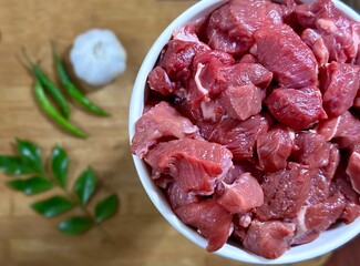 Fresh beef in a bowl on blurred background 