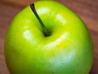 Simple composition with a green apple, conveying the concept of natural food.
