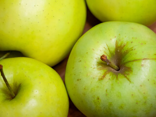 The apples vibrant color and texture indicate freshness, suitable for a produce market ad.