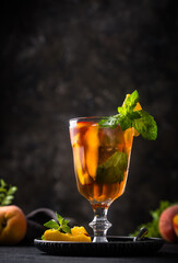 Cold ice tea with peach and mint
