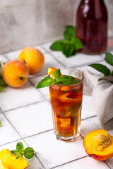 Cold ice tea with peach and mint