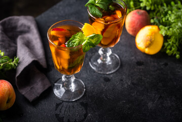 Cold ice tea with peach and mint
